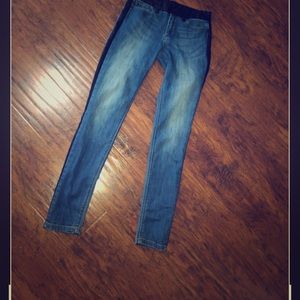 Skinny blue jeans with leather on the sides